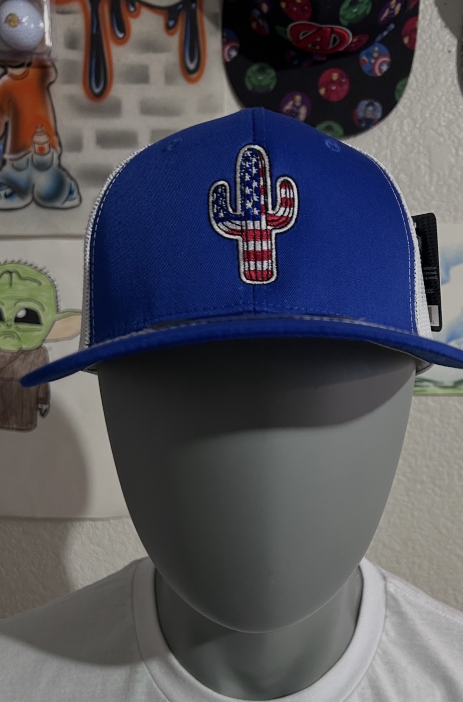 Royal blue trucker cap with an Arizona-shaped cactus patch in flag colors