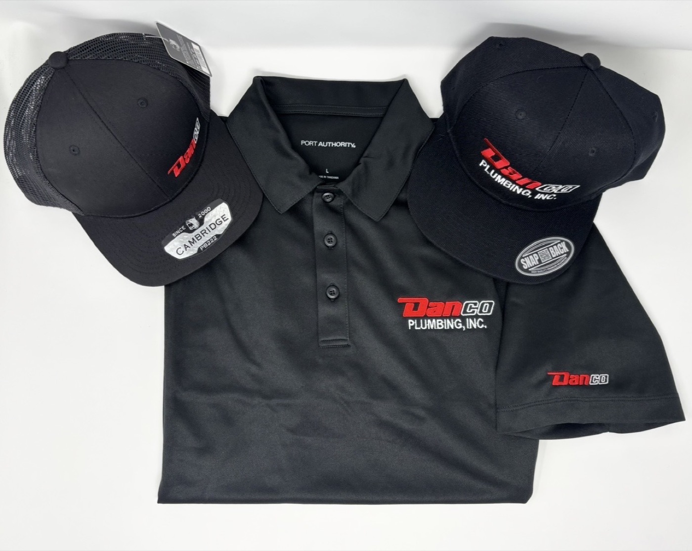 DanCo Plumbing polo and snapbacks with left-chest and full logo embroidery