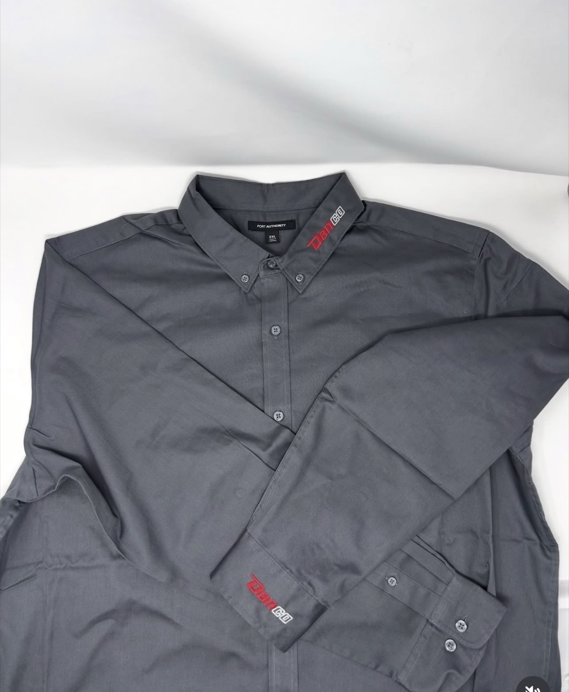 DanCo Plumbing button-down work shirt with collar and cuff logo embroidery