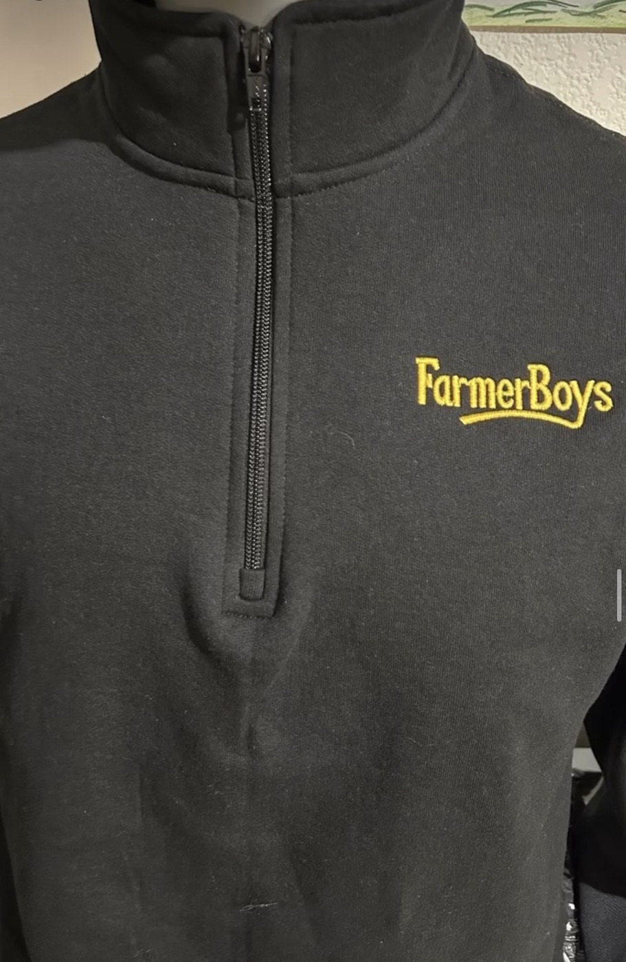 Black quarter-zip pullover with the FarmerBoys logo embroidered on the chest