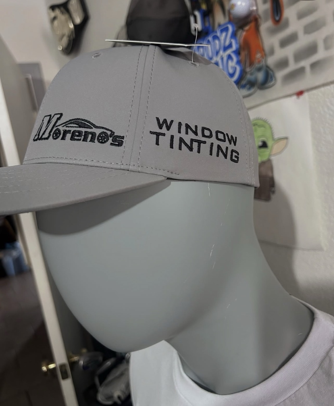 Gray structured cap with Moreno's Window Tinting embroidered on the side panel